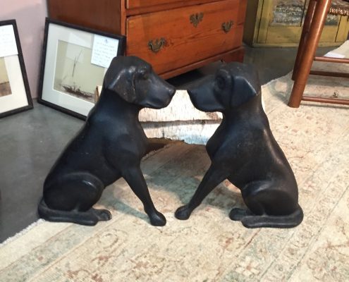 c. 1930s American cast iron andirons in shape of facing pair of black Labrador dogs